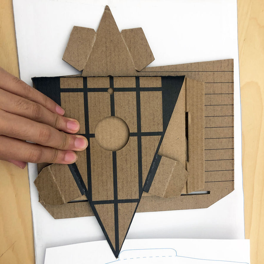 Photo of a model building the DIY A-Frame Bird House.