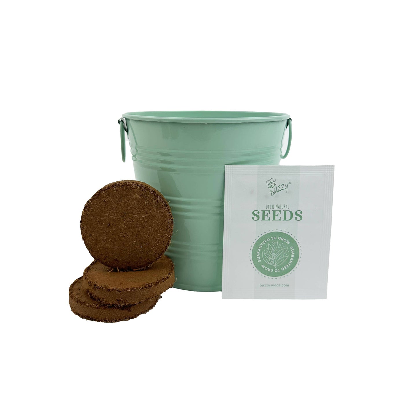 Green bucket, brown dirt disks, and a white seed packet on a white background