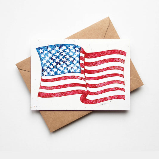 Card with American flag design on a white background with a brown envelope.