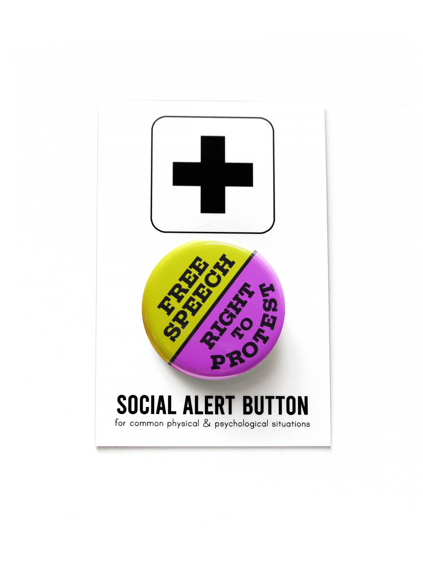 Bright green and purple ‘Free speech, Right to protest’ text button on black and white ‘Social alert button, for common physical & psychological situations’ packaging on top of a white background. 