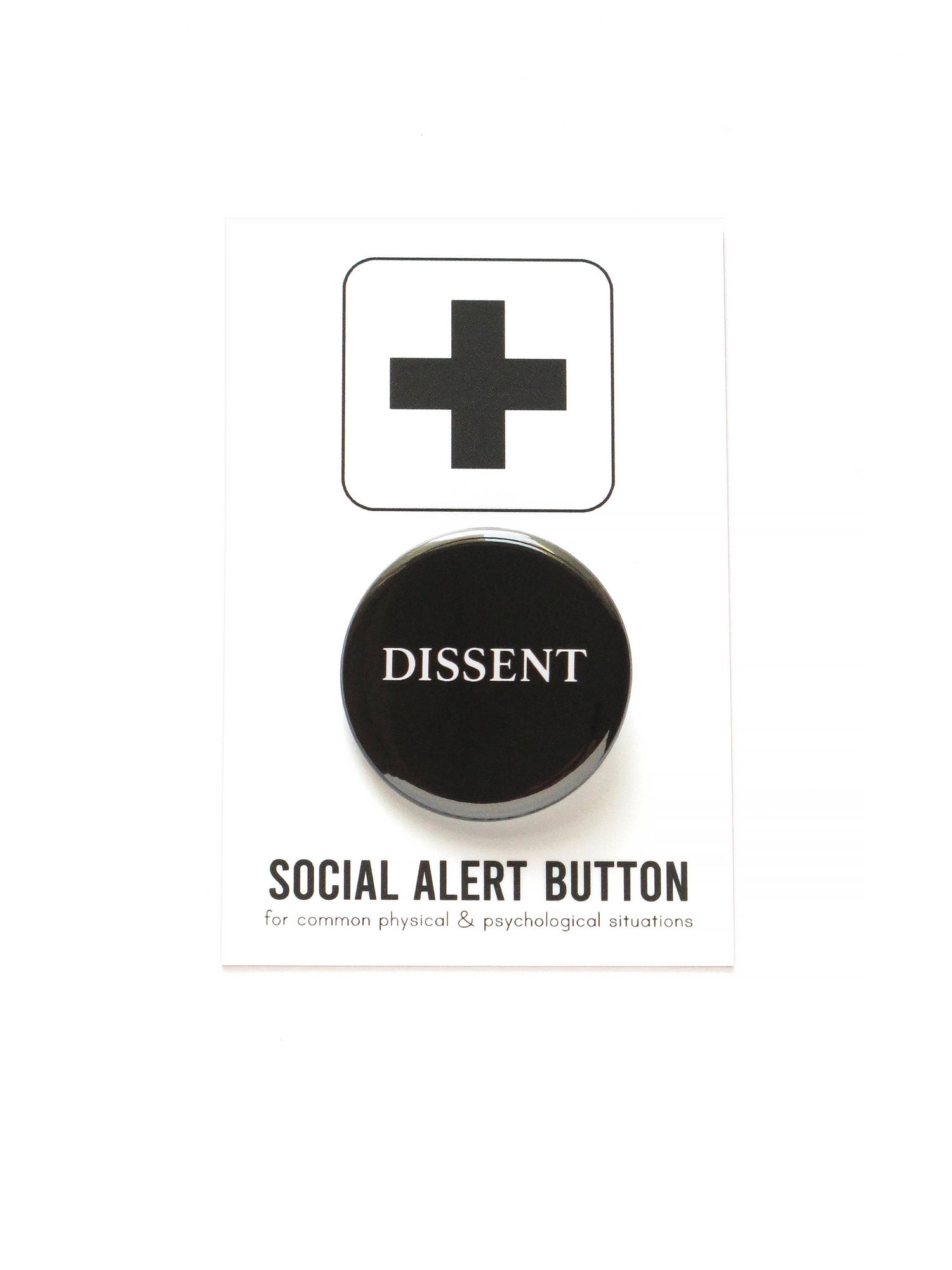 Black button with 'DISSENT' text on black and white ‘Social alert button for common physical & psychological situations’ packaging, on a white background