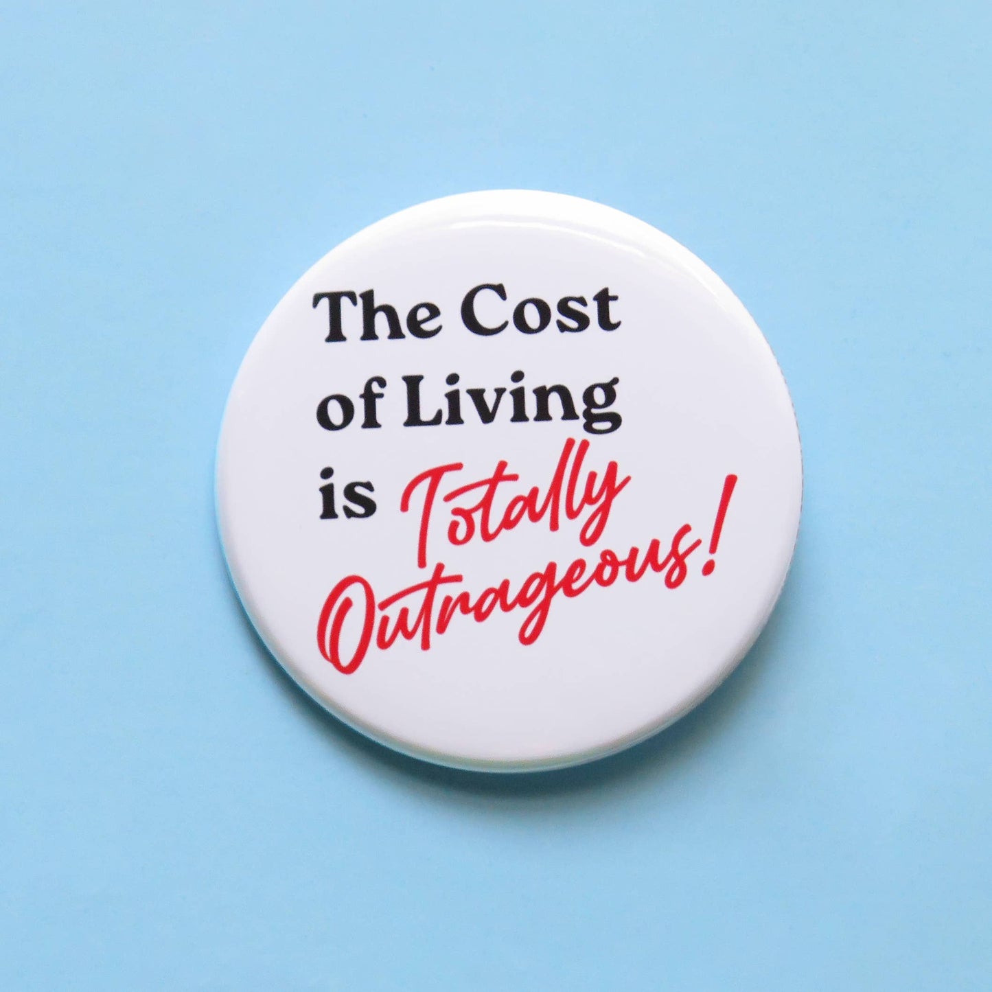 Button badge with text 'The Cost of Living is Totally Outrageous!' on a light blue background