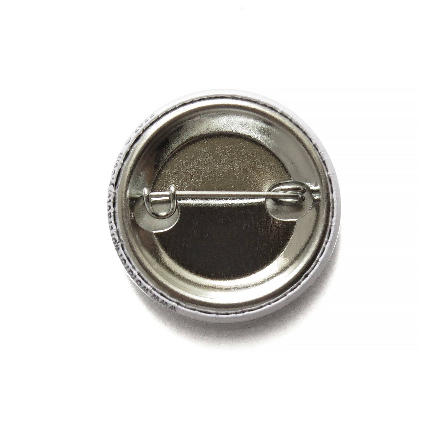 Back of button with metal pin on a white background.