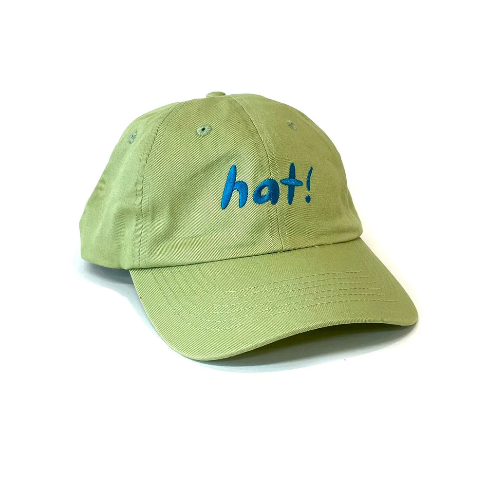 Green cap with blue 'hat!' text on a white background