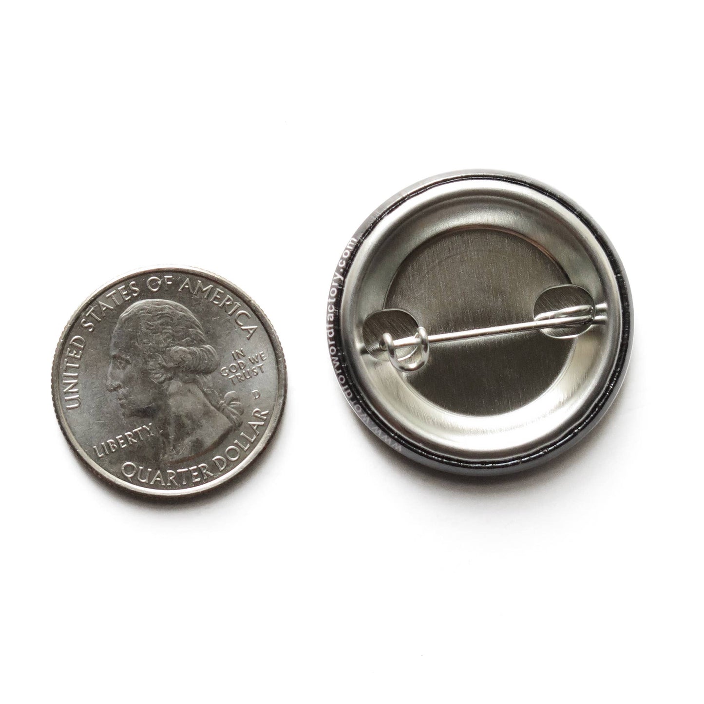 US quarter coin next to the back of a button with a metal pin on a white background.