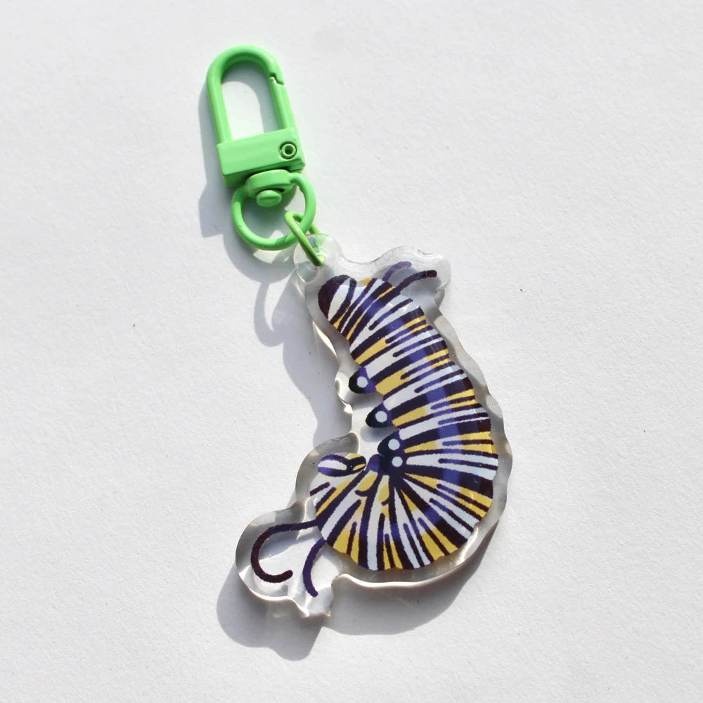 Keychain with a colorful cat design on a white background.