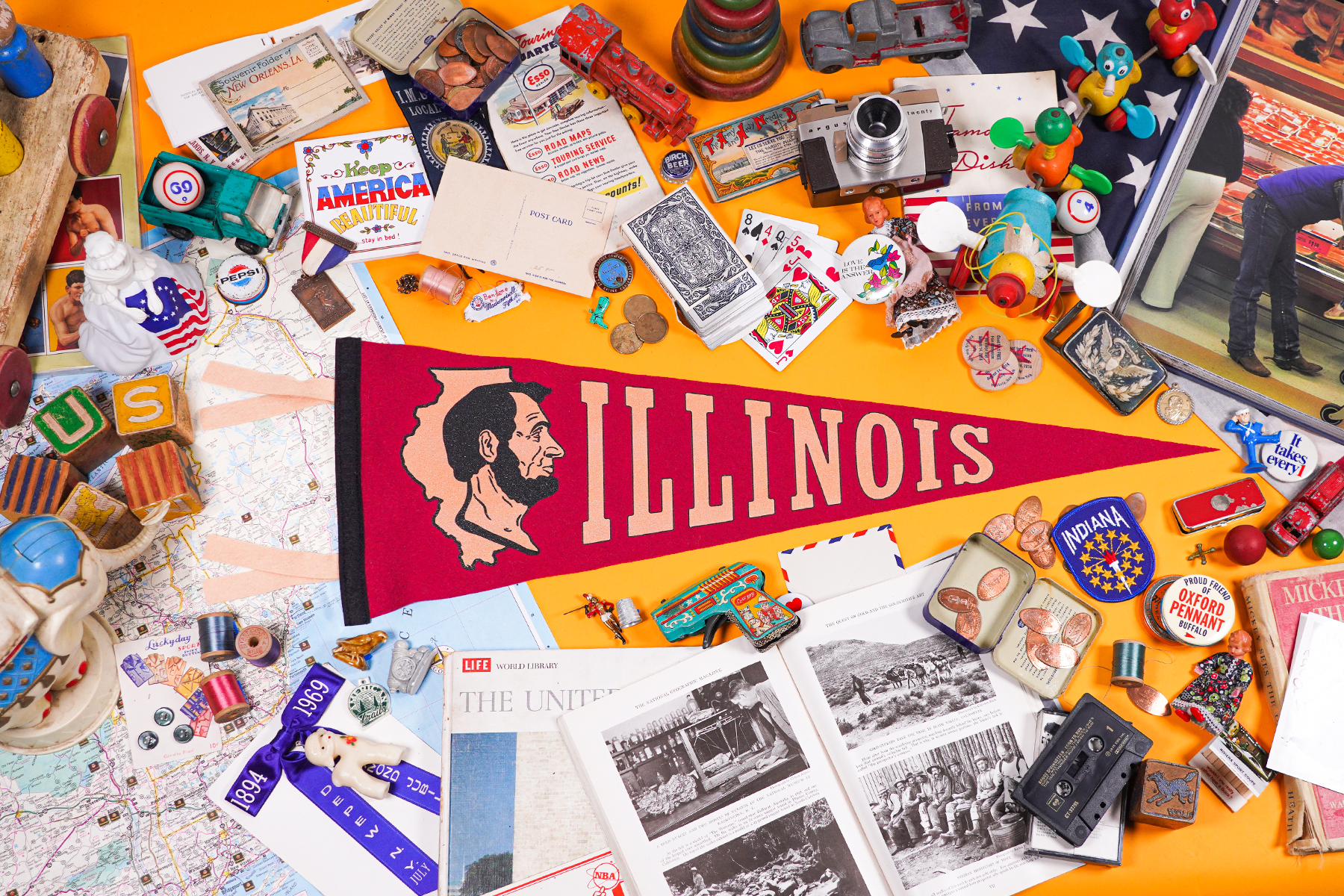 Styled photo of the Illinois Pennant, with retro and state themed items.