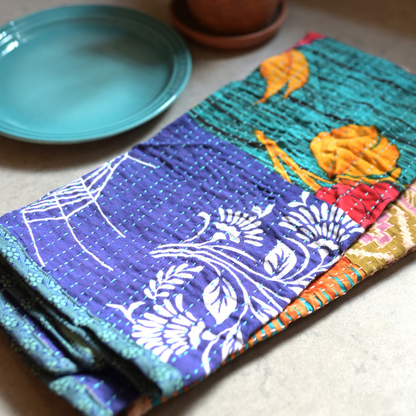 Styled photo of Sari Home Tea Towel Set next to dishes.