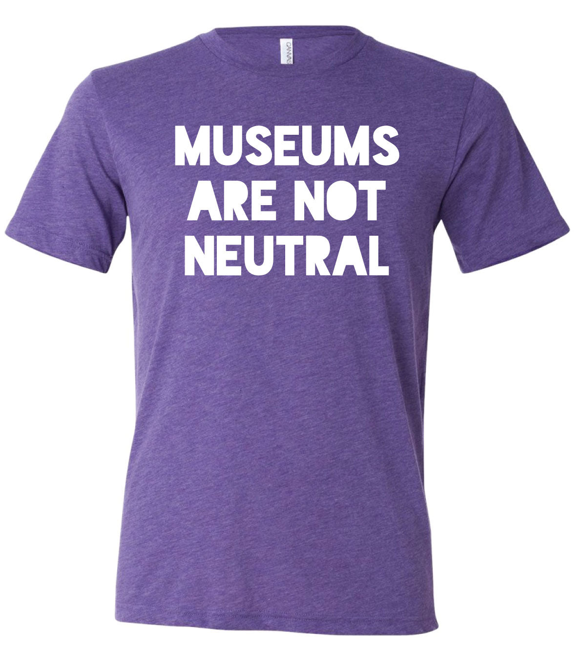 Photo of purple tshirt with white font, reading “Museums Are Not Neutral”.