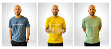 Load image into Gallery viewer, Model in yellow Museum Nerd 2.0 tshirt in front of white background.
