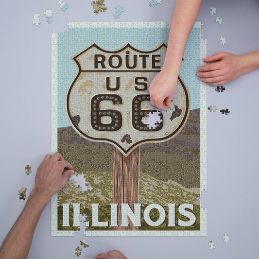Photo of models putting together the “Route 66” 1000 Piece Illinois Puzzle.