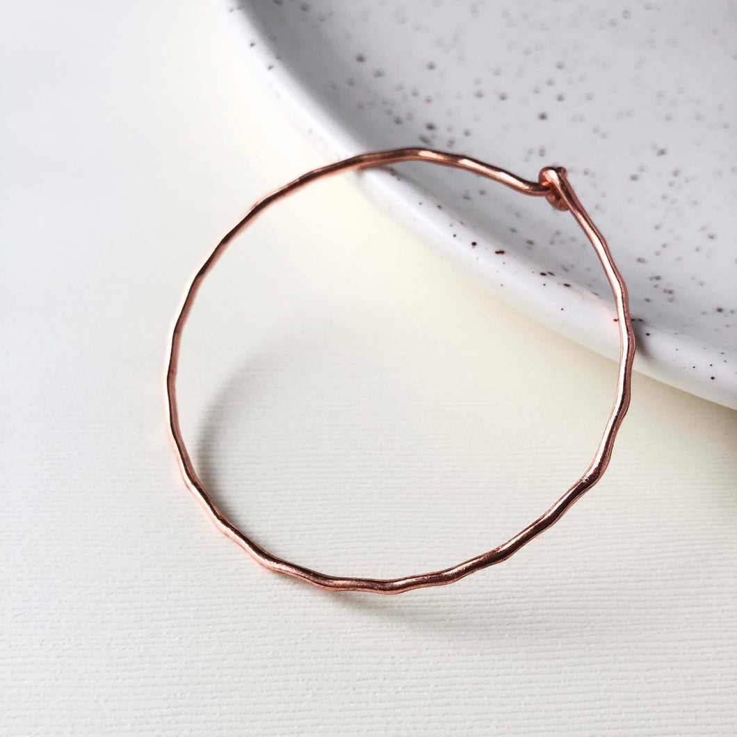 Photo of the copper “Interlocking Ripple” Bracelet.
