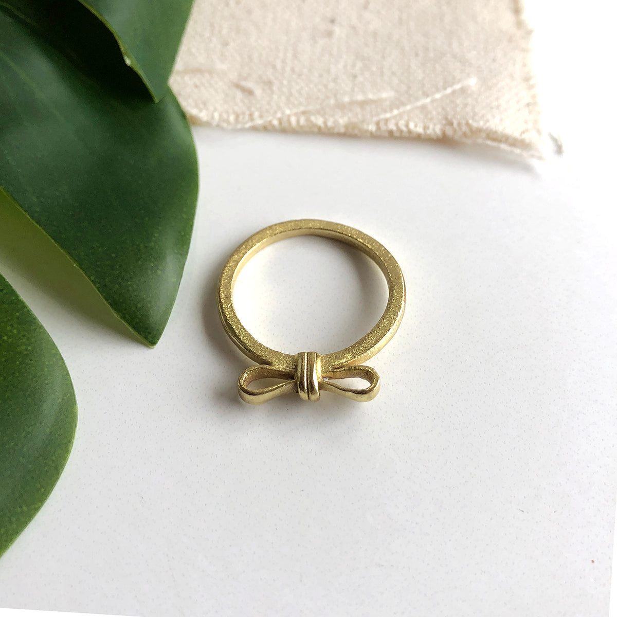 Photo of the gold “Wrapped Bow” Ring.