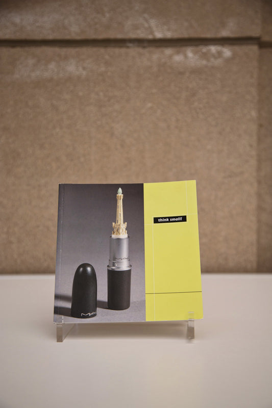 “Think Small!” Book sitting on stand.