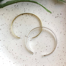 Load image into Gallery viewer, Photo of the gold and silver “Simple Band” Cuffs, next to each other.
