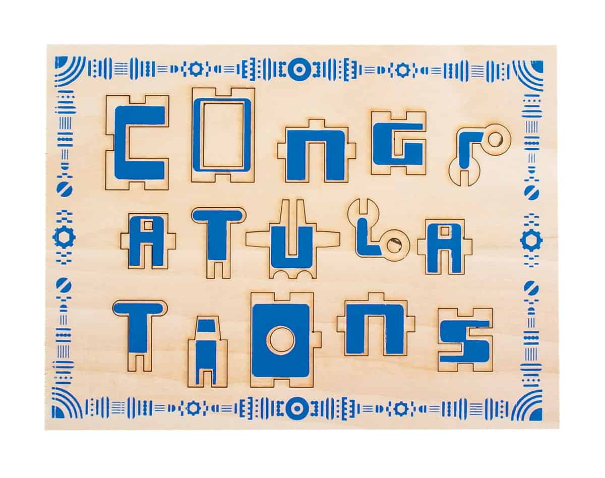Perforated wooden greeting card saying Congratulations.
