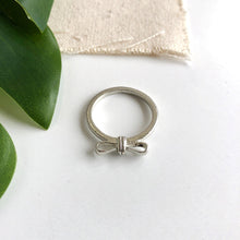 Load image into Gallery viewer, Image of the silver “Wrapped Bow” Ring.

