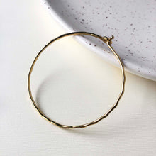 Load image into Gallery viewer, Photo of the gold “Interlocking Ripple” Bracelet.

