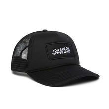Load image into Gallery viewer, “You Are On Native Land” Trucker Hat in black.
